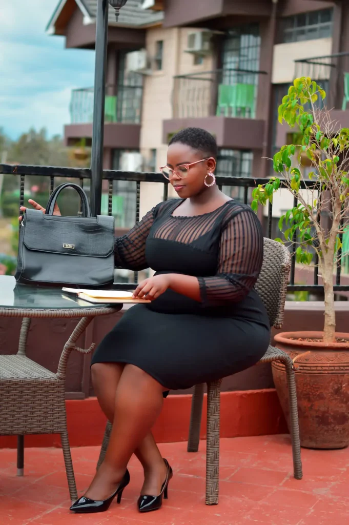 A professional woman seated in an office