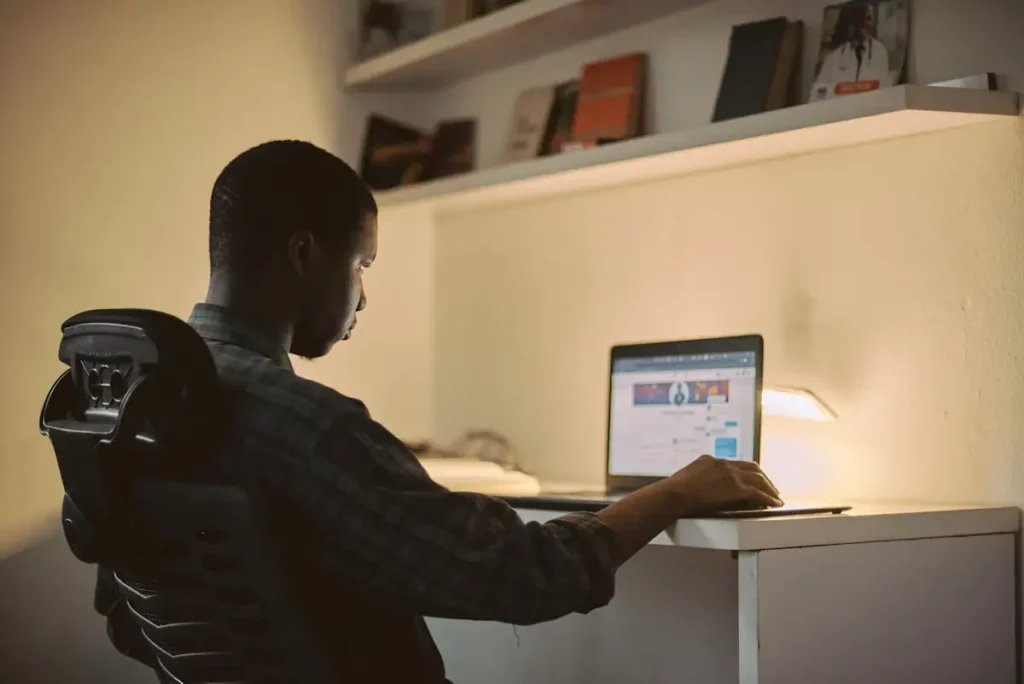 A professional working on a laptop