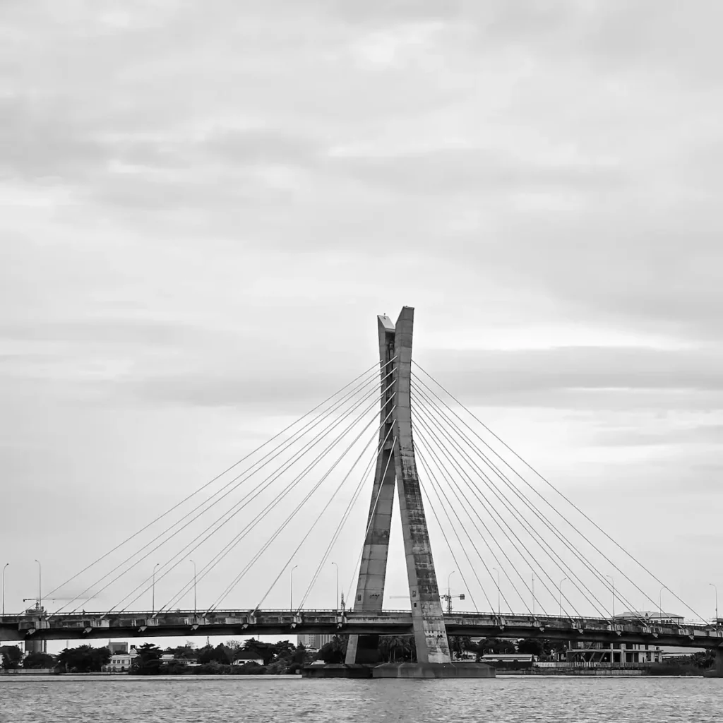 The Lagos lagoon and link bridge, an adviser in a blue shirt and tie